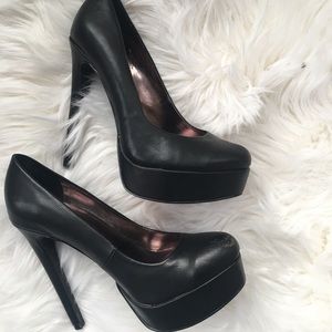 Black platform pumps